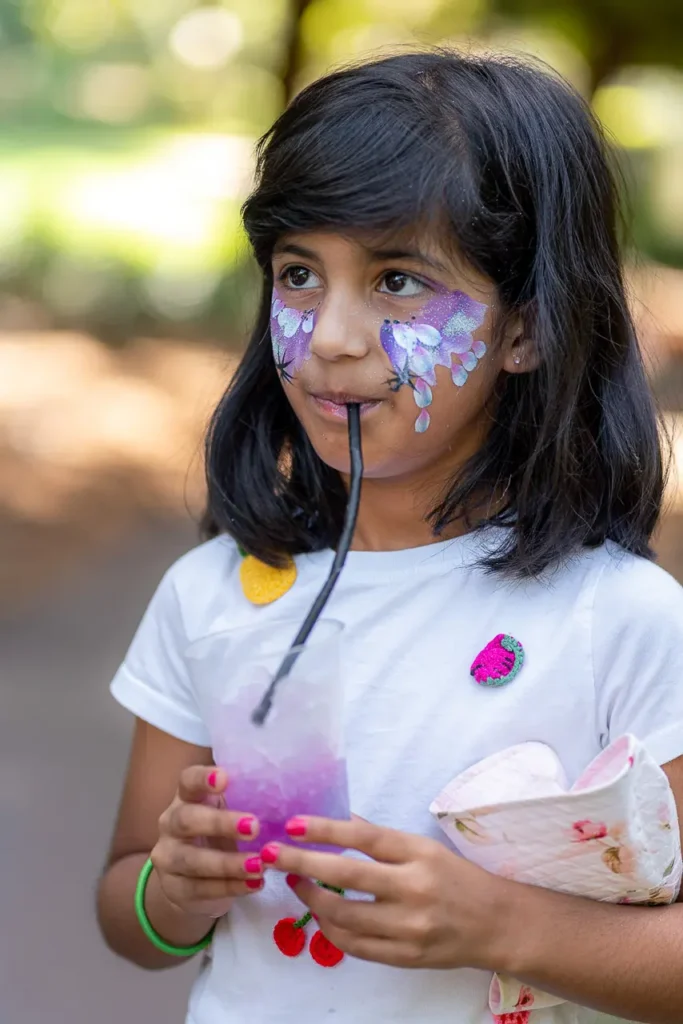 North Sydney event photography capturing a child with face paint at the playground opening