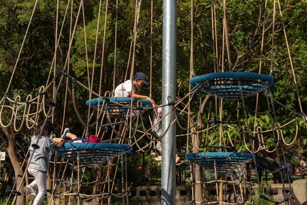 North Sydney event photography capturing a young child exploring the St Leonards Park playground