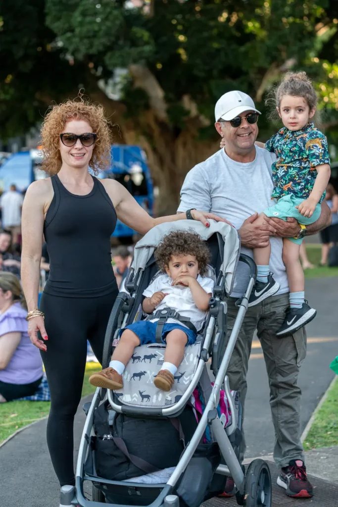 Family with two young children enjoying the Sunset Series community festival in North Sydney