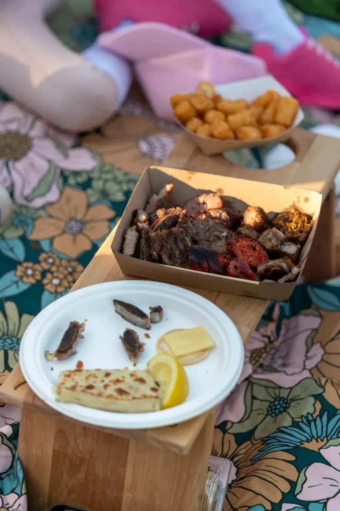 Picnic food and grilled dishes at the Sunset Series outdoor community event in North Sydney