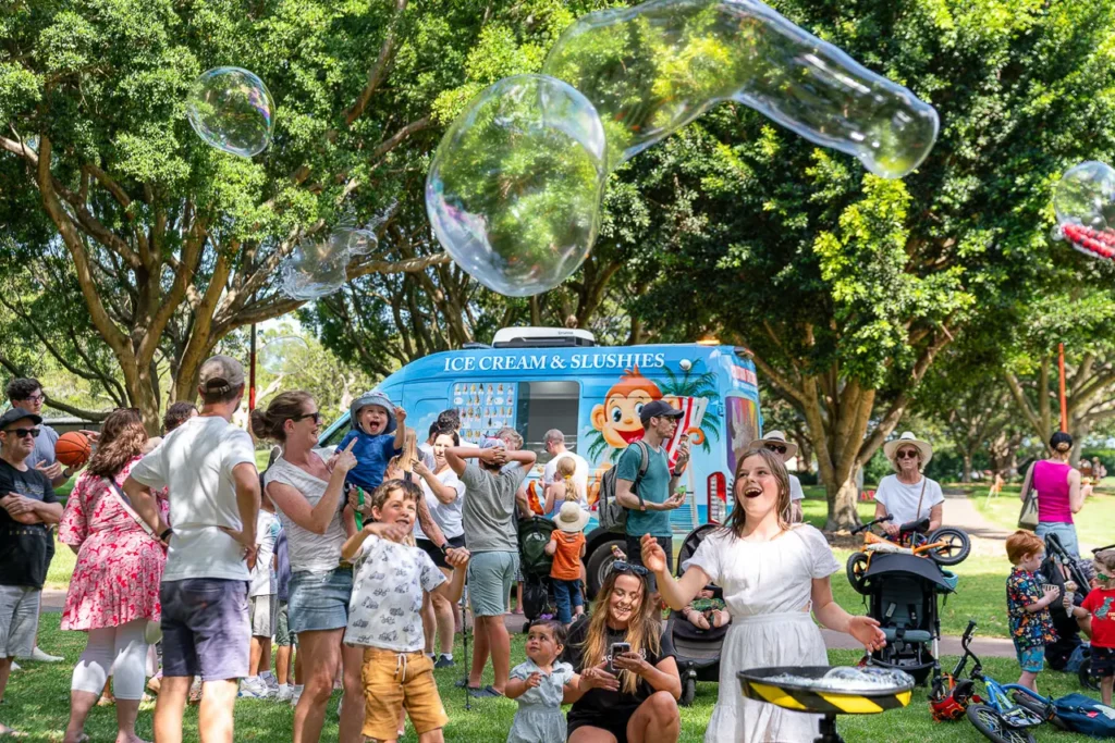 Community event photography showing families enjoying the St Leonards Park playground opening in North Sydney
