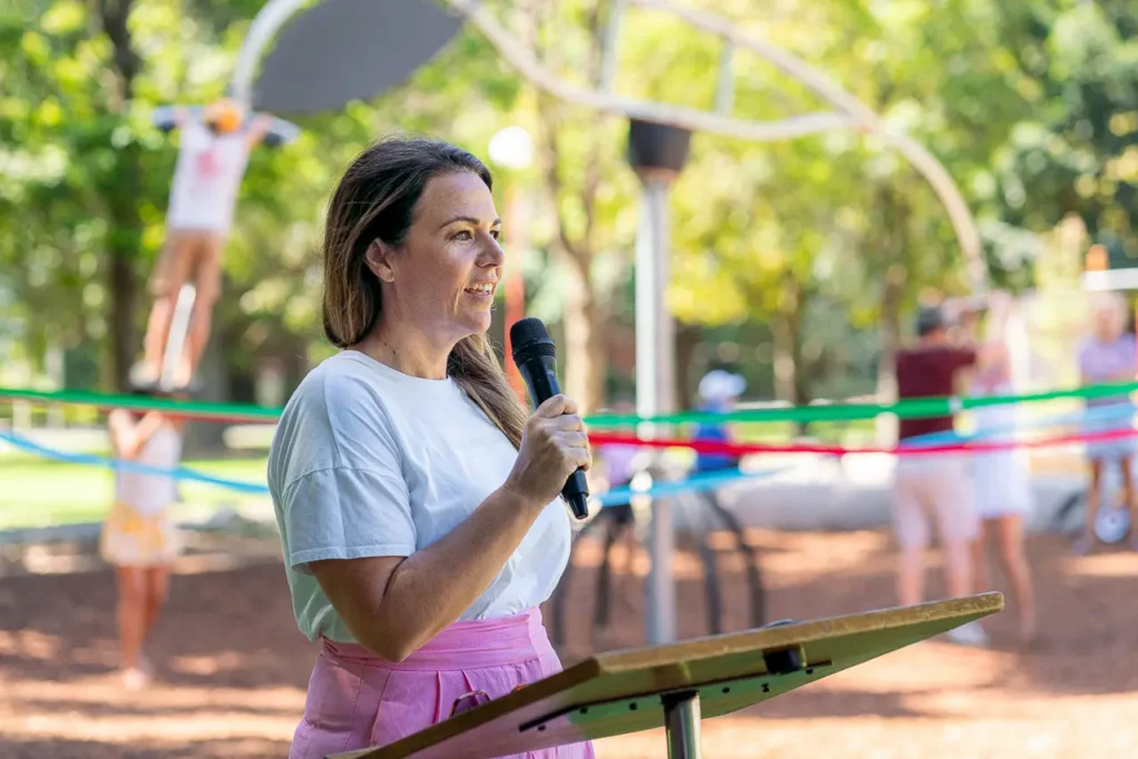 Event photography of a speaker at the St Leonards Park playground opening in North Sydney