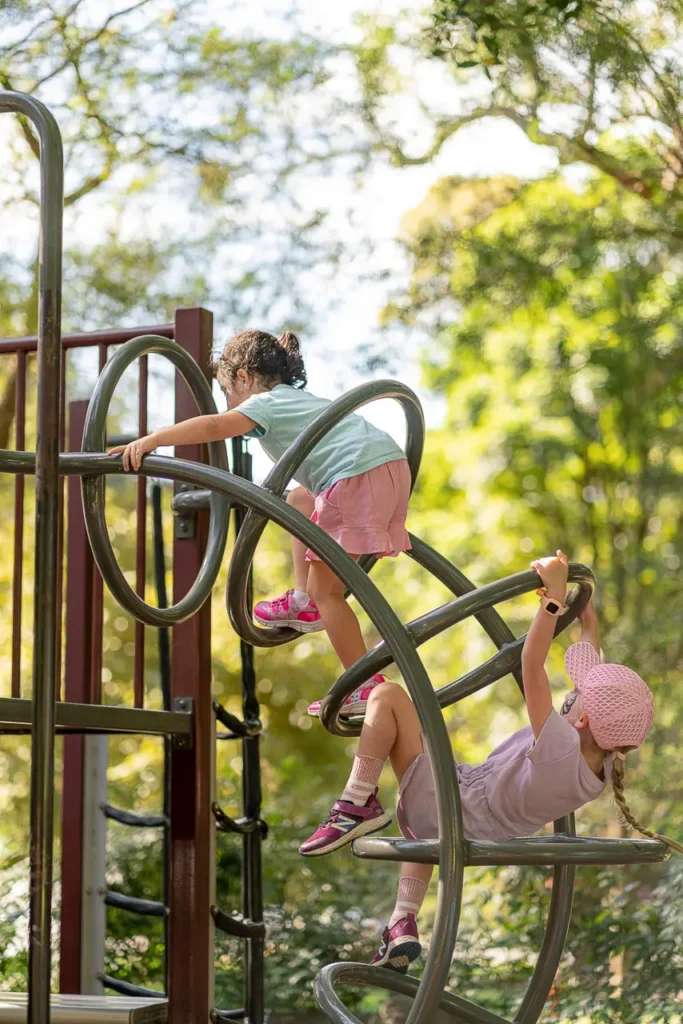 Event photography capturing children climbing at the St Leonards Park playground opening in North Sydney