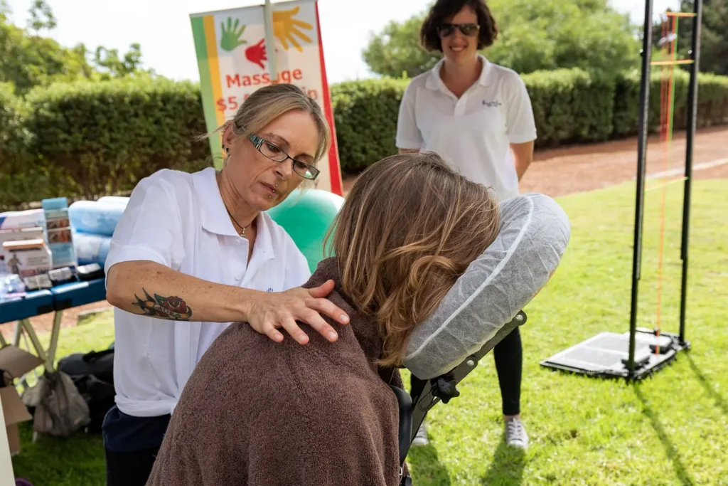 Massage demonstration captured during expo event photography in Sydney