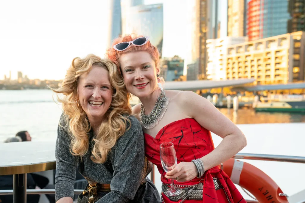 Friends celebrating together aboard a private Sydney Harbour cruise