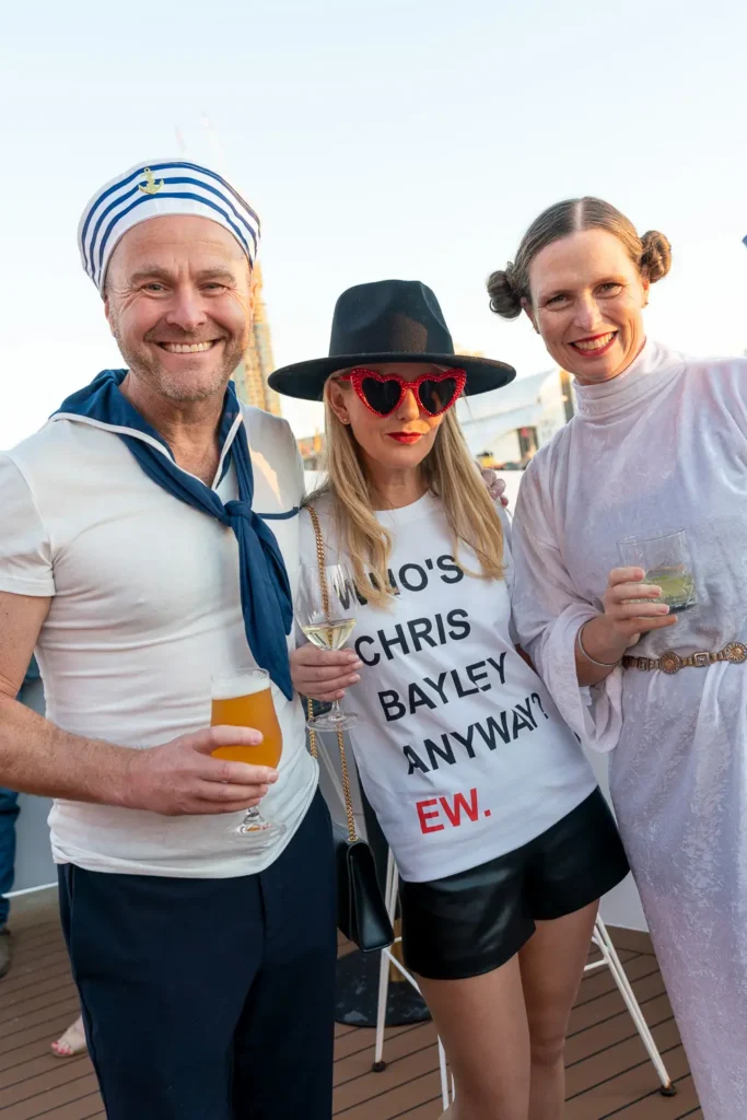 Friends in costume enjoying a private party cruise on Sydney Harbour