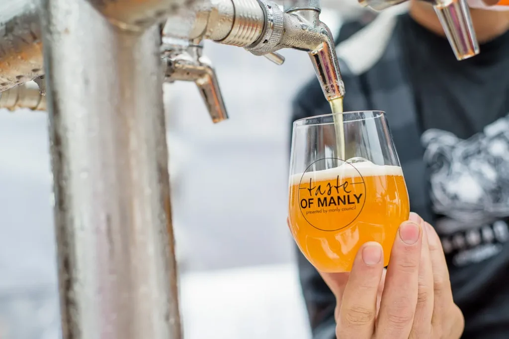 Craft beer being poured at Taste of Manly food and wine festival