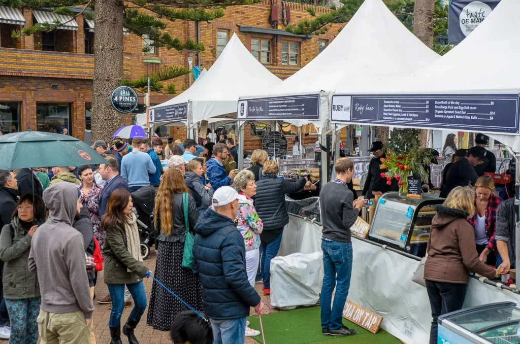 Busy food stalls and festival visitors at the Taste of Manly