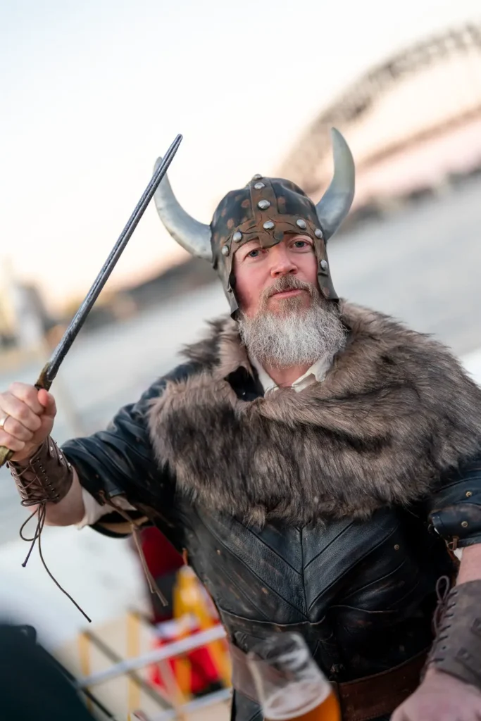 Guest dressed as a Viking posing at a Sydney corporate costume event